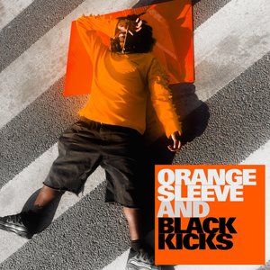 ORANGE SLEEVE AND BLACK KICKS