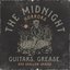 Guitars, Grease, and Shallow Graves