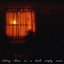 sitting alone in a dark, empty room