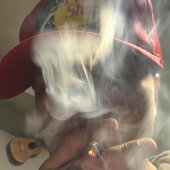 Compa Luisito smoking some exotic strain