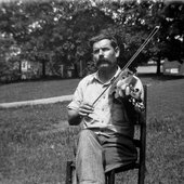 The mustached Ed Morrison plays the fiddle.jpg